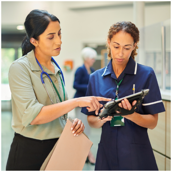 Two clinicians interacting in a hospital