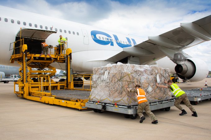 Staff loading cargo onto plane 