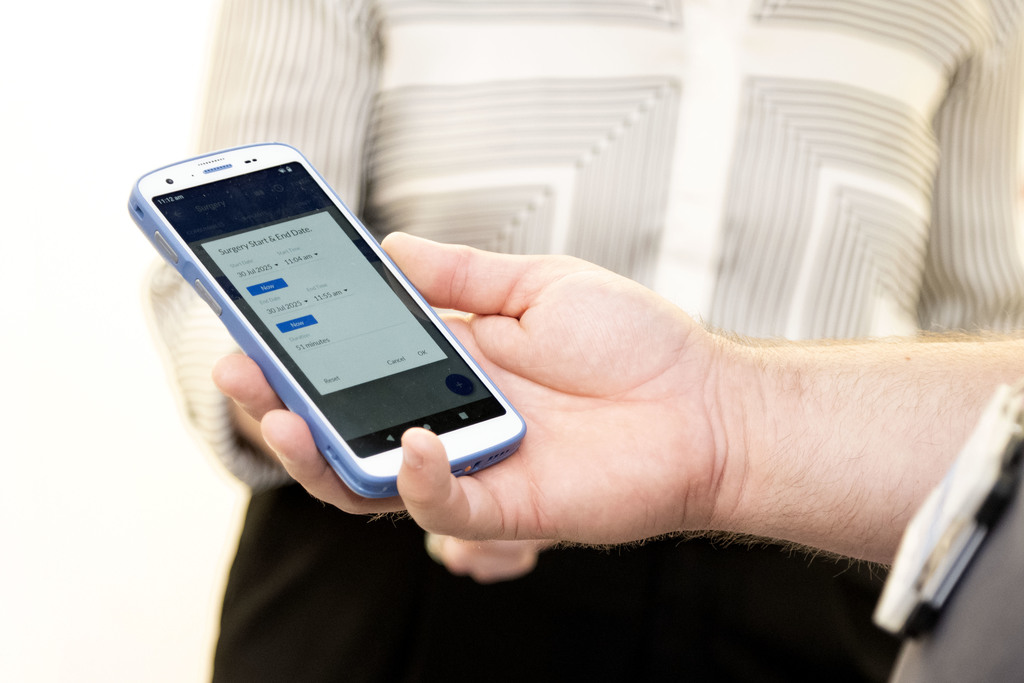 Inventory Management System scanner in clinician's hand