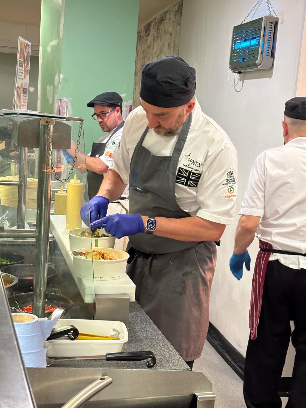 Chefs serving food in Royal Free Hospital’s kitchen