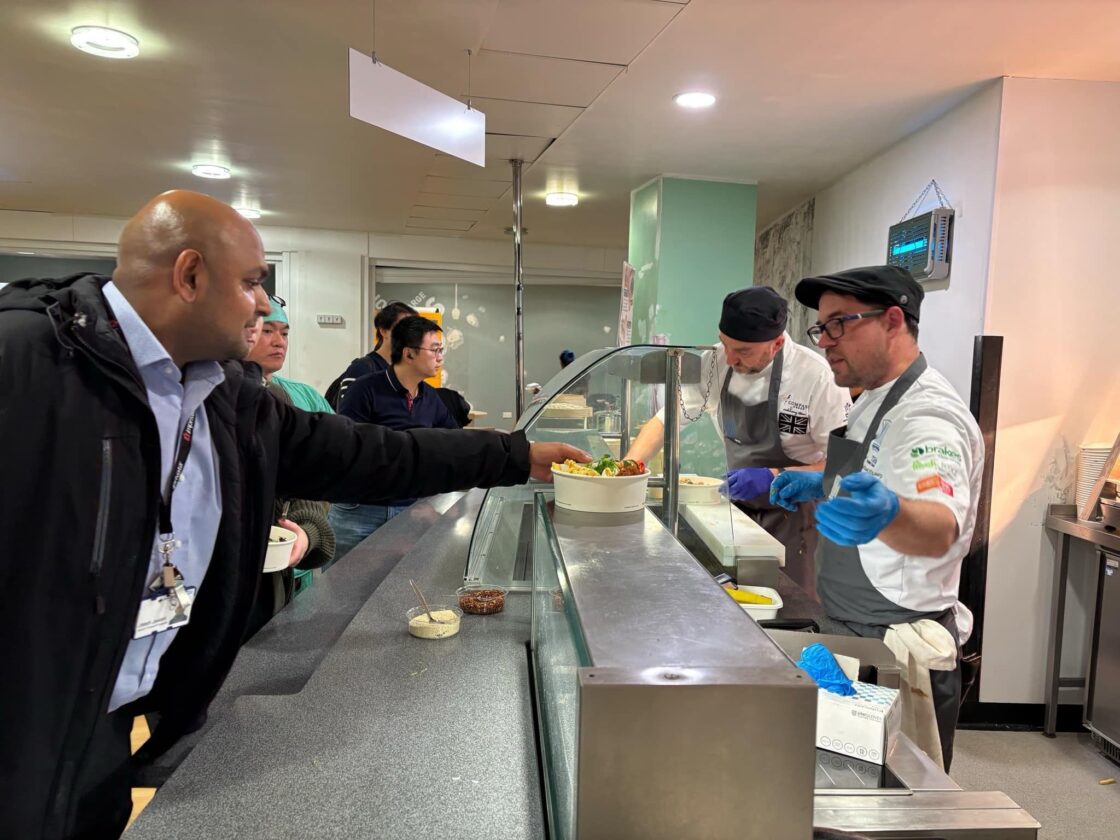Chefs serving food in Royal Free Hospital’s kitchen Chefs serving food in Royal Free Hospital’s kitchen