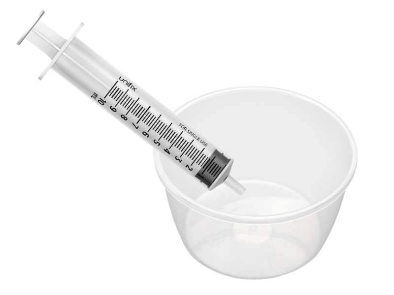 Syringe and a clear plastic bowl or pot Syringe and a clear plastic bowl or pot