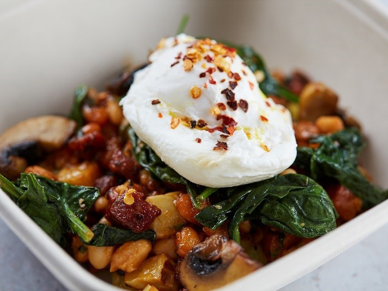 Potato, chorizo and bean breakfast hash with wilted spinach and poached egg