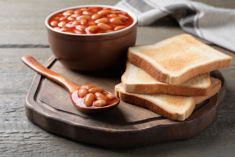 Baked beans in a bowl and toast Baked beans in a bowl and toast
