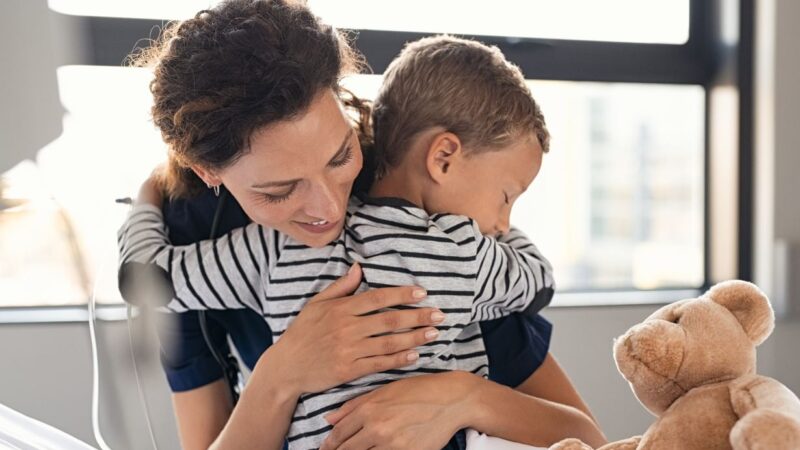 Child patient mother or a nurse hugging with teddy bear