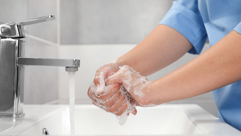 Image of doctor washing their hands