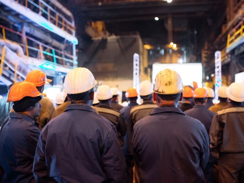 workers in a group hard hats overalls factory workers in a group hard hats overalls factory