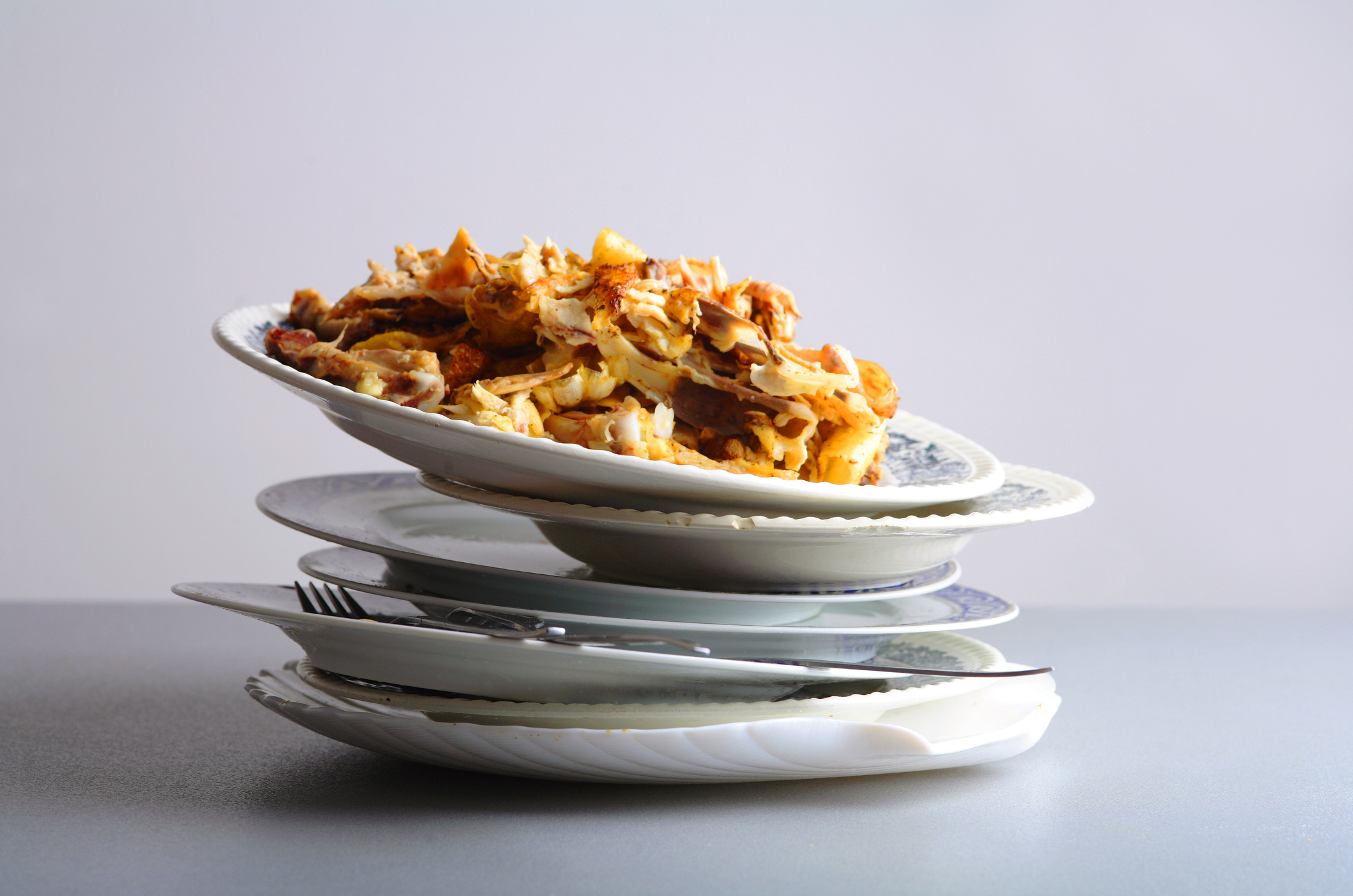 Food Waste on a stack of plates. 