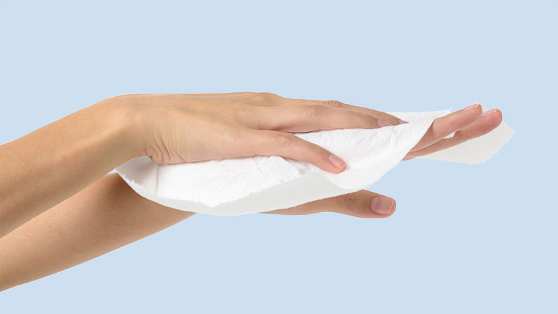 Using a dry wipe to wipe hands