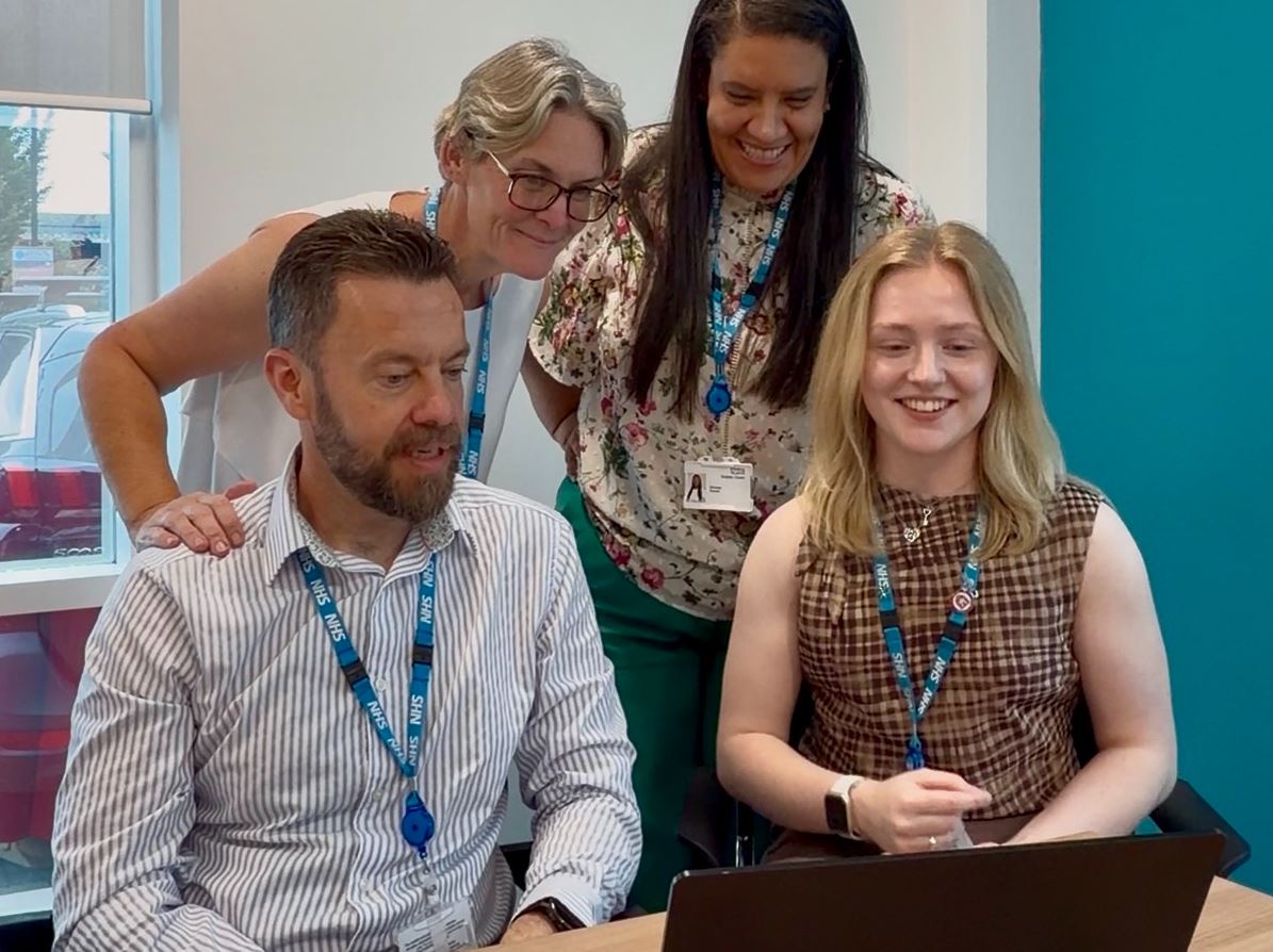 Innovation team on a call on a laptop in the office Innovation team on a call on a laptop in the office