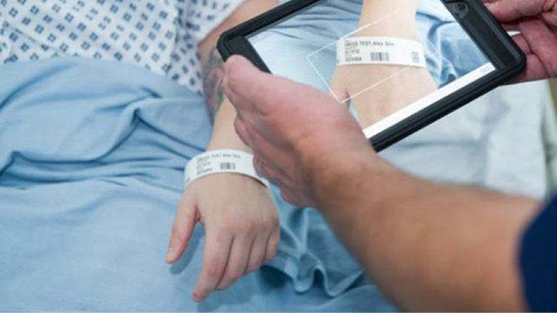 Patient having bar code scanned on wrist band