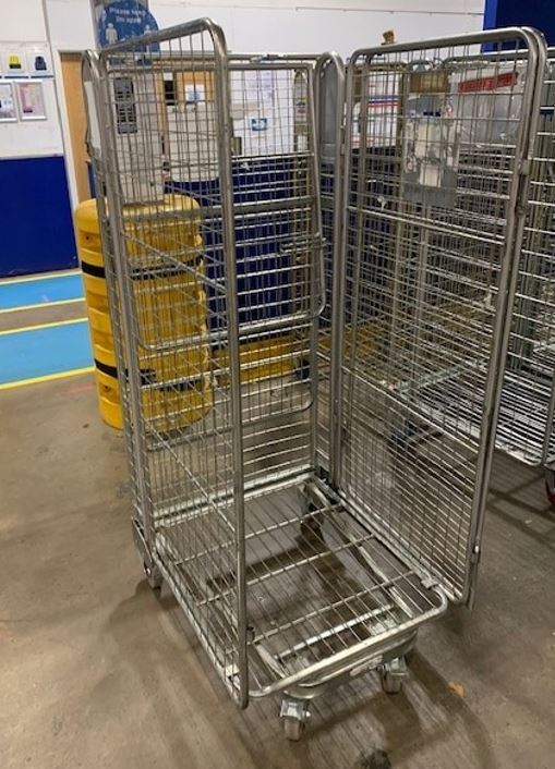 Empty roll cage in a warehouse