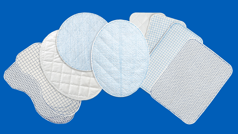 Surgical mesh products on a blue background