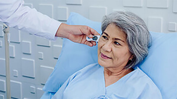 Patient having temperature taken