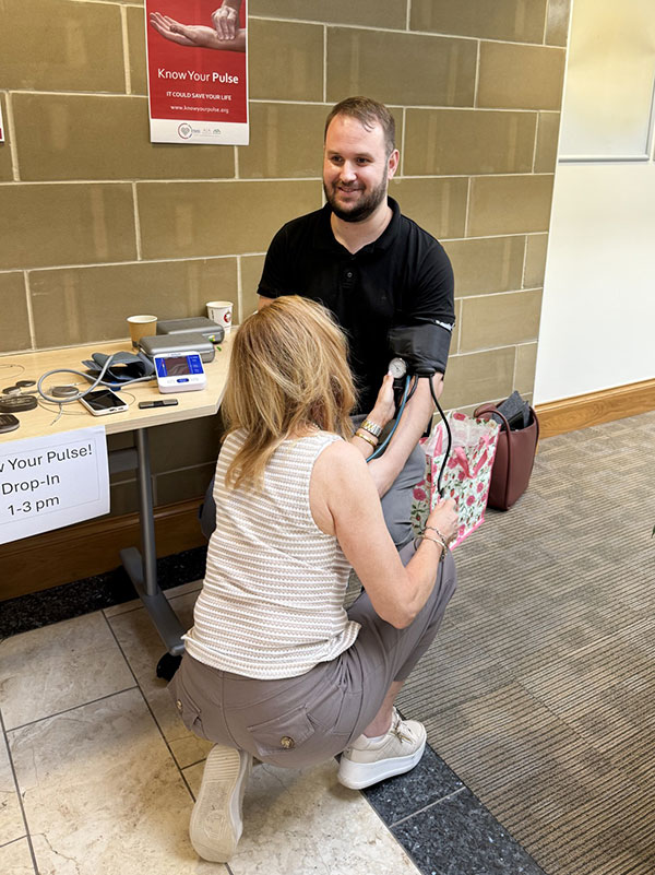Cardiac Physiologists teaching colleagues how to take their blood pressure Cardiac Physiologists teaching colleagues how to take their blood pressure